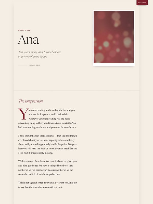 An anniversary page: the name Ana set large in a serif on warm ivory paper, beside a photograph.
